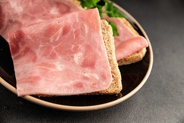Ham slices meat spam pork fresh delicious gourmet food background on the table rustic food top view copy space