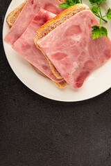 Ham slices meat spam pork fresh delicious gourmet food background on the table rustic food top view copy space