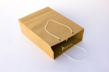 Blank brown paper bag for shopping isolated on white background