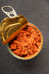 Tuna tomato sauce canned fish seafood fresh delicious gourmet food background on the table rustic food top view copy space keto and paleo diet vegan food pescetarian diet