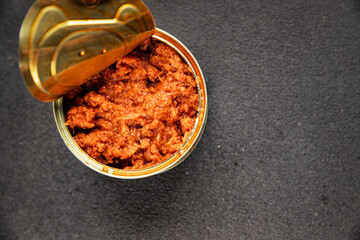 Tuna tomato sauce canned fish seafood fresh delicious gourmet food background on the table rustic food top view copy space keto and paleo diet vegan food pescetarian diet