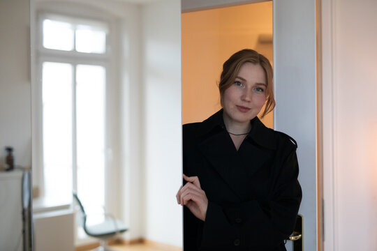 businesswoman looking out window