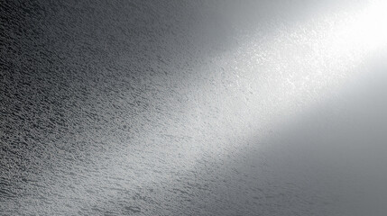Elegant silvery textured surface with a gentle light gradient