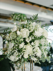 Elegant floral arrangement in a sophisticated venue during a daytime event
