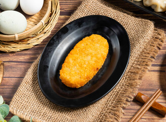 Crispy Golden Hash Brown Patty on a Black Plate, Classic Breakfast Side view of hong kong food