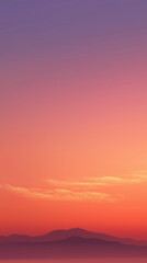 Obraz premium Vivid sunset sky over distant mountains with soft clouds