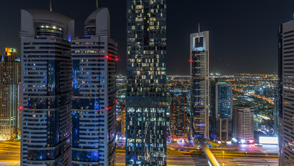 Skyline view of the buildings of Sheikh Zayed Road and DIFC night timelapse in Dubai, UAE.