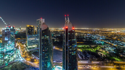 Fototapeta premium Skyline view of the buildings of Sheikh Zayed Road and DIFC night timelapse in Dubai, UAE.