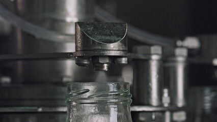 Industrial machine sterilizing glass jars in food