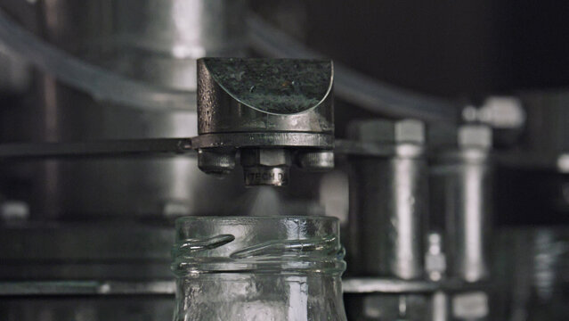 Industrial machine sterilizing glass jars in food