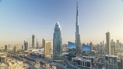 Tableau sur plexiglas Burj Khalifa Dubai downtown skyline at sunset timelapse with tallest building and Sheikh Zayed road traffic, UAE  © HyperlapsePro