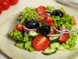 Greek Salad Close-Up on Light Beige Background