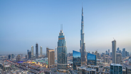 Fototapeta premium Dubai downtown skyline day to night timelapse with tallest building and Sheikh Zayed road traffic, UAE