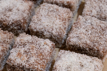 Lamington sponge cakes coated in chocolate and coconut
