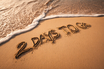 Fototapeta premium “2 Days to Go” Handwritten in Warm Beach Sand with an Incoming Wave and Serene Lighting for Event Teasers