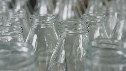 Empty glass bottles awaiting filling in industrial