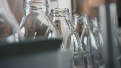 Empty glass bottles waiting to be filled with milk