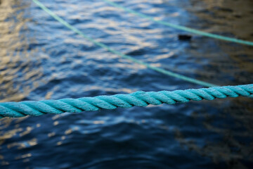 Close up of a rope against water