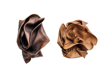 two pieces of leather are shown on a white surface