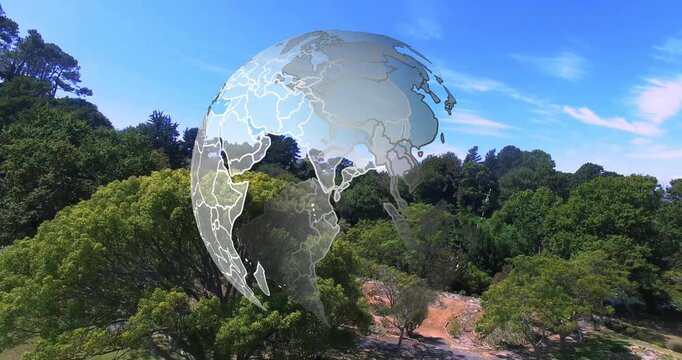At clip start translucent globe materializing over park, rotating and revealing continent outlines