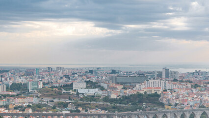 Panoramic overview during sunrise over Lisbon and Almada from a viewpoint in Monsanto morning...