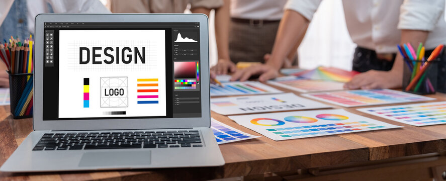 Graphic designer software for modern design of web page and commercial brisk ads showing on the computer screen - Powered by Adobe