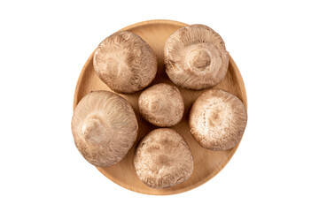 a wooden plate with mushrooms on it