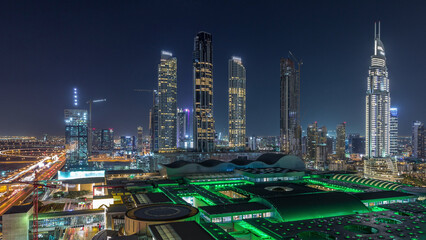 Aerial view of Financial center road night timelapse with under construction buildings