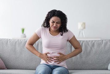 Ill, bad feeling, stomach problems, menstruation, disease and poisoning. Despaired sad millennial...