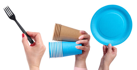 Hands holding disposable cutlery: black plastic fork, brown and blue paper cups, and a blue paper plate.