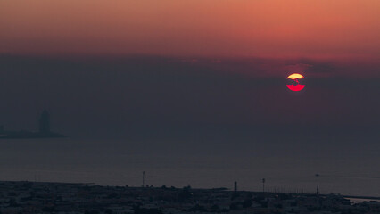 Panorama and aerial view of coastline Dubai at sunset timelapse, United Arab Emirates