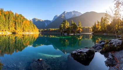 Fototapeta premium Serene autumn lake reflecting mountains