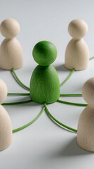 Obraz premium Wooden figures connected by green wires in a network people connection
