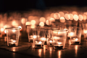 Tealight Candles in Plastic Cups at Night Vigil