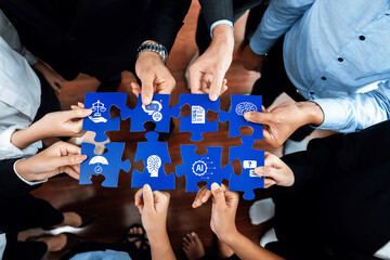 A diverse group of hands are collaboratively assembling puzzle pieces, symbolizing the integration...