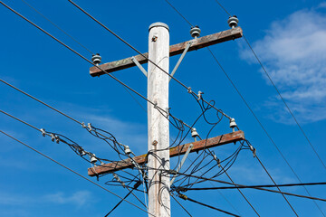 Photograph of the top cable section of an old style wooden electricity transmission line support...