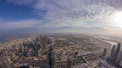 Downtown of Dubai in the morning timelapse after sunrise. Aerial view with towers and skyscrapers