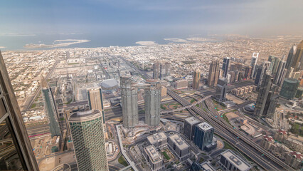 Obraz premium Downtown of Dubai in the morning timelapse after sunrise. Aerial view with towers and skyscrapers