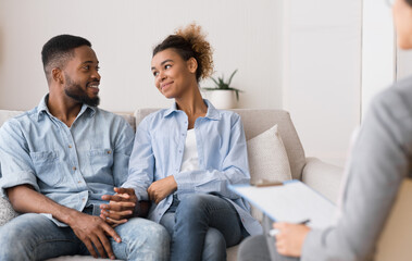 Restored Marriage. Loving Afro Spouses Holding Hands After Successful Marital Counseling With Their...