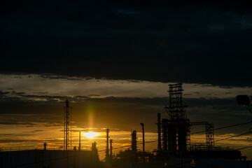 Fototapeta premium Sunset silhouettes at oil refinery Detroit Michigan 