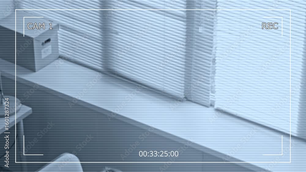 Wall mural security camera footage of two focused office employees typing on computers while working at desks i