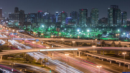 Dubai Golf Course with a cityscape of Greens and tecom districts at the background aerial night...