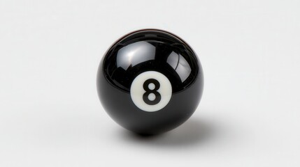 A close-up shot of a black billiard ball featuring the number eight, perfect for sports-related themes, gaming materials, or decor around recreational spaces