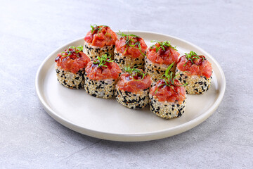 Sesame Crusted Tuna Roll with Spicy Sauce and Scallion Garnish
