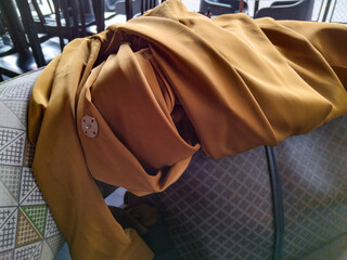 Trench coat on sofa, montevideo, uruguay