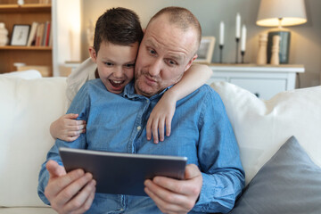 Home, dad or kid on laptop for education, bonding or streaming online for movie, cartoon or video. Technology, download or single parent father with boy, child or touchscreen for learning development.