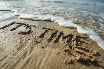 It’s Time Message Carved in Wet Sand with Receding Wave Marks – Ideal for Motivational Posters or Nature-Inspired Quote Designs