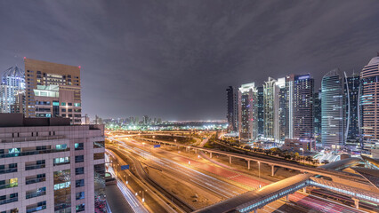 Fototapeta premium Aerial top view to Sheikh Zayed road near Dubai Marina and JLT timelapse, Dubai.