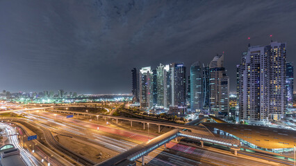 Obraz premium Aerial top view to Sheikh Zayed road near Dubai Marina and JLT timelapse, Dubai.