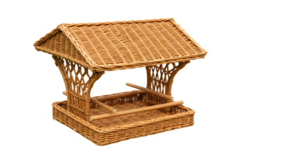 A rustic wicker bird feeder with a thatched roof set against a plain background, ideal for garden decoration and wildlife photography